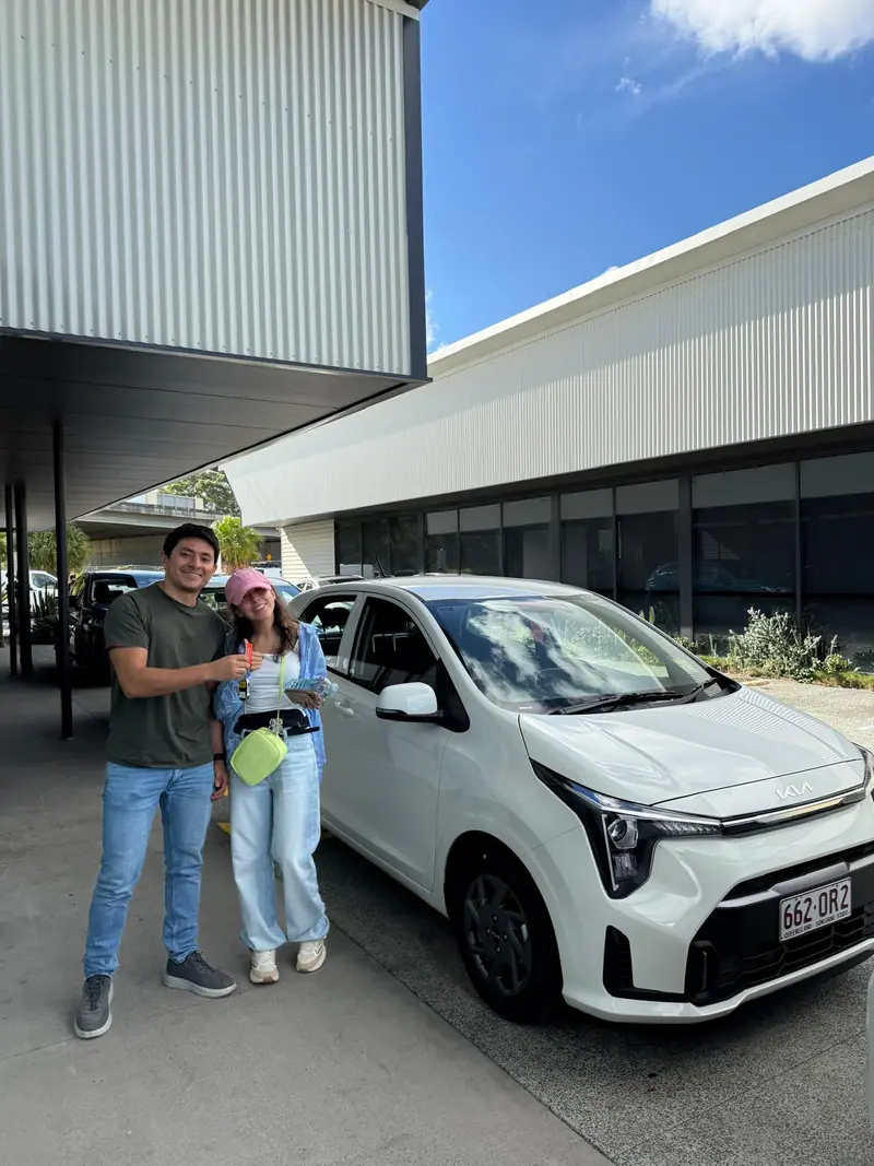 Happy couple with their new Kia